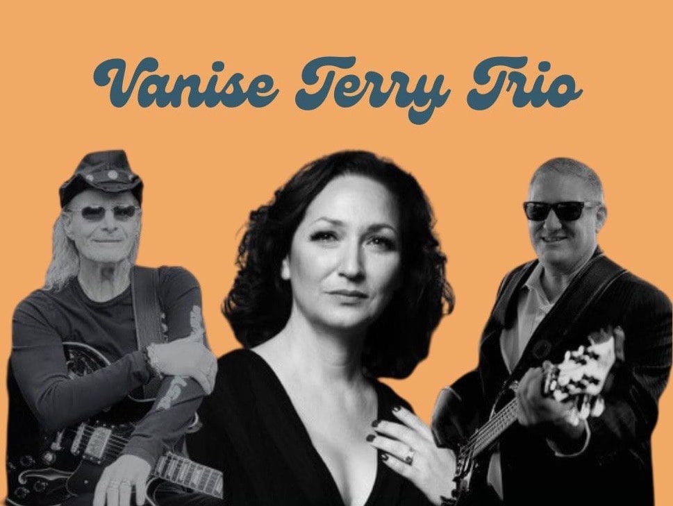 Black and white photo of three musicians under the title "Vanise Terry Trio" on an orange background. The two men are holding guitars, and the woman is in the middle, facing forward.