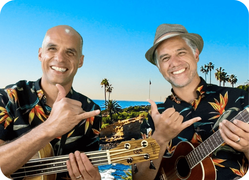 Kalama Brothers performing live outdoors at Ventura Harbor Village with guitars and tropical shirts.